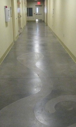 An etched concrete hallway with an abstract design. 