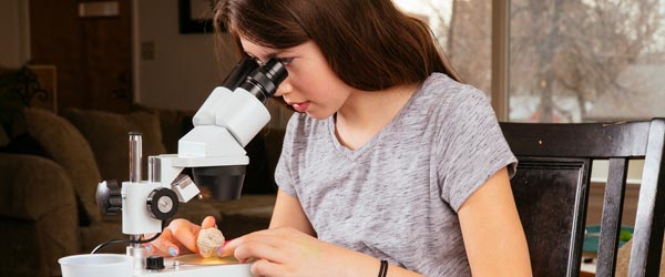 girl at microscope